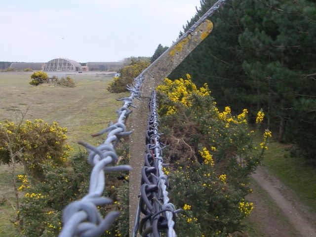 RAF Woodbridge - amidst Rendlesham Forest The perimeter fence of the former USAAF base showing hardened shelters on the left and the Corsican pine plantations of the Forestry Commission's