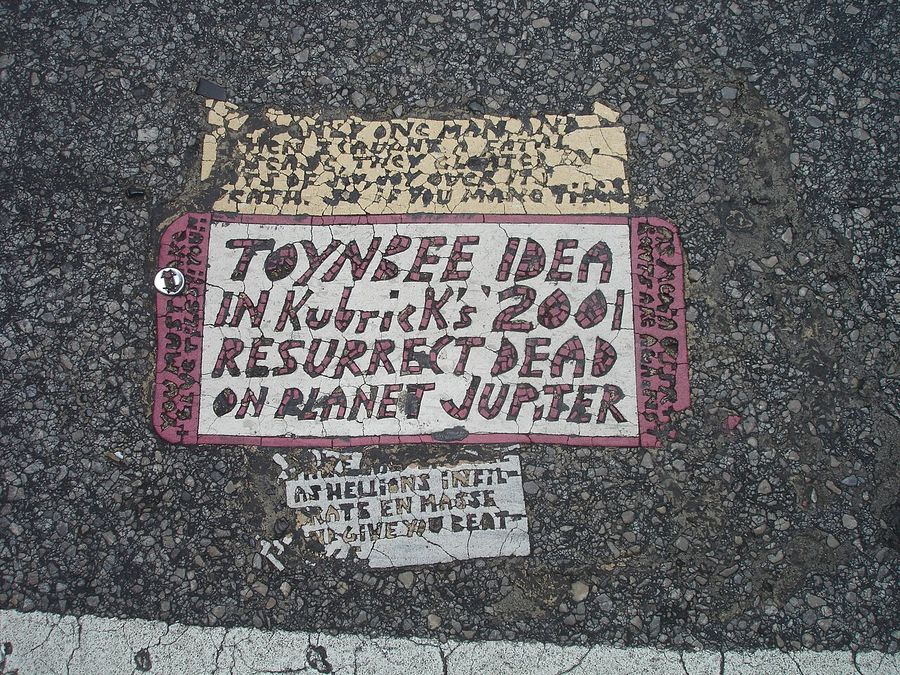 Toynbee tile located in the crosswalk at the intersection of 13th and Market Street in Philadelphia